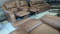 Brown genuine leather 3-2-1 recliner sofa set with console in showroom
